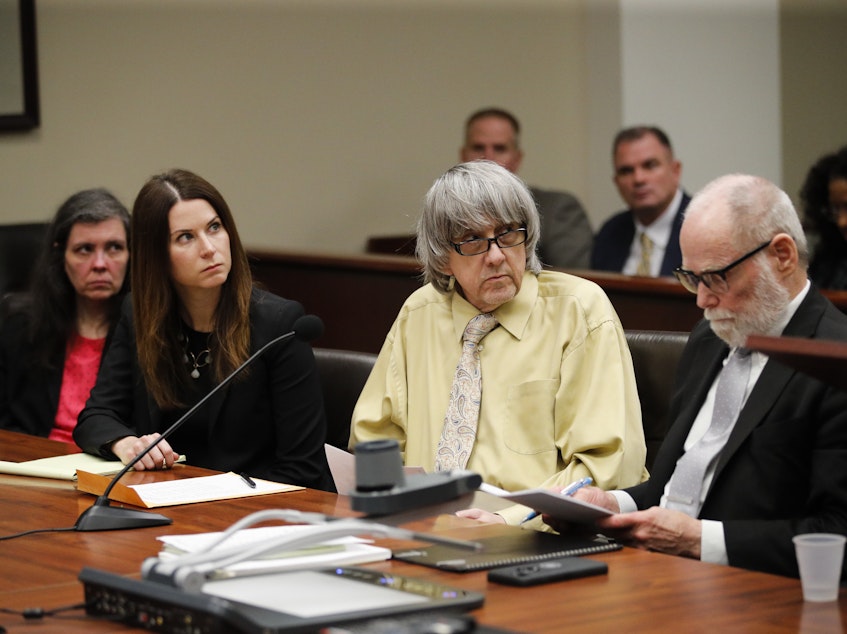 caption: David Turpin (second from right) and wife, Louise, (far left) joined by their attorneys, pleaded guilty in a Riverside, Calif., courtroom, Friday to several charges, including torture, after some of their 13 children were found shackled to beds.