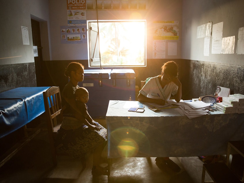 caption: A 19-year-old woman talks with nurse Valeria Zafisoa at a traveling contraception clinic in eastern Madagascar run by the British nonprofit group Marie Stopes International.
