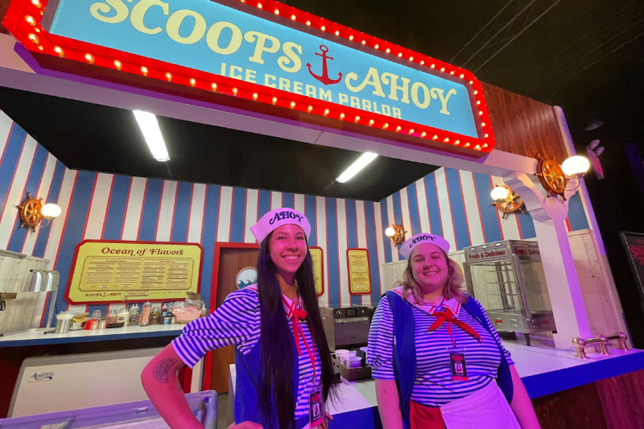 caption: Trinity Clark and Lauren Duncan travel to the 1980s to work at Scoops Ahoy at "Stranger Things: The Experience," live in Seattle over the summer of 2023. 