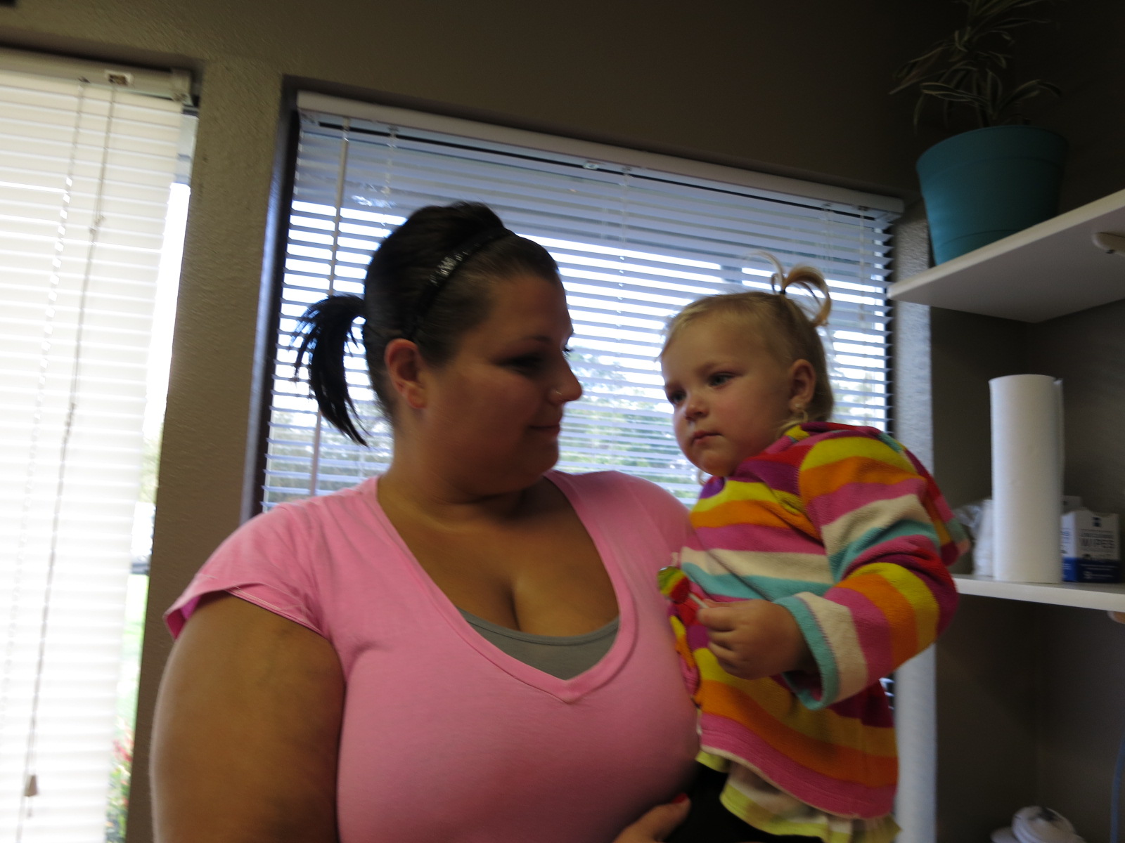 caption: Carmin Russell, who brought her 2-year-old into the Yelm Sea Mar clinic said getting care used to be an all-day event.