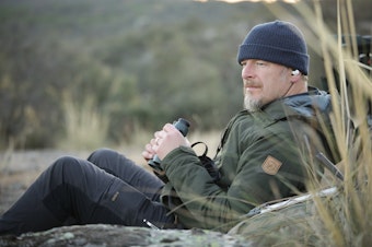 caption: THE WILD host Chris Morgan obverses his surroundings while recording for an episode in Portugal. 