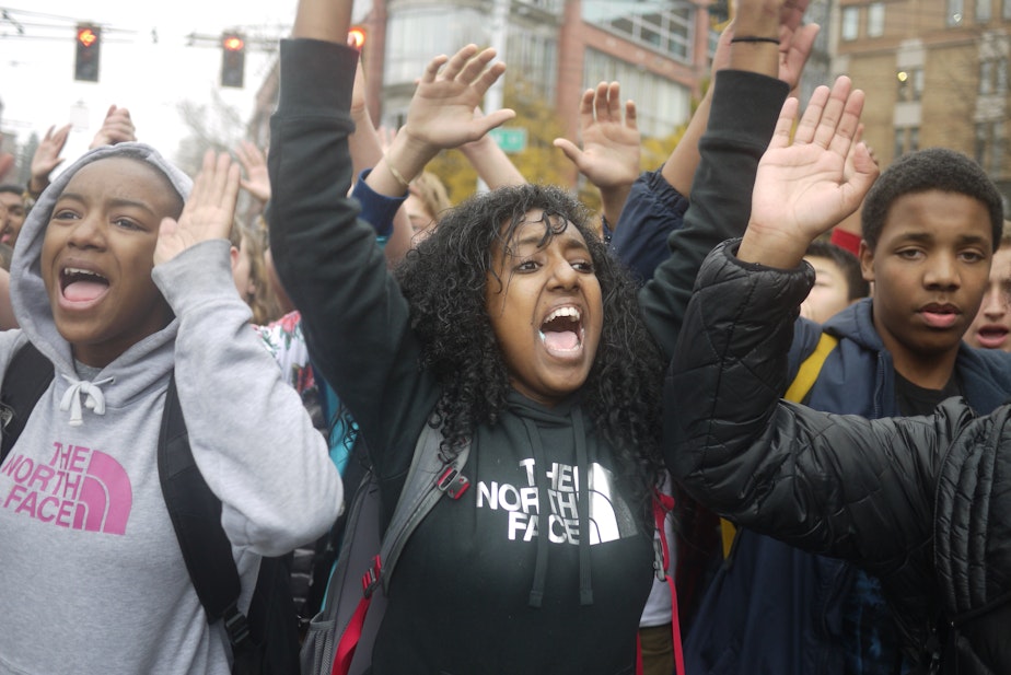 caption: Demonstrators march in Seattle on Tuesday to protest the grand jury decision in the Michael Brown case. Among those marching were 1,000 students from Garfield High School.