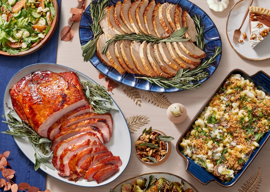 caption: Blue Apron’s popular Thanksgiving menu returns, featuring a traditional turkey dinner, plant-forward vegetarian meal and a honey-glazed baked ham.