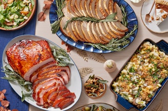 caption: Blue Apron’s popular Thanksgiving menu returns, featuring a traditional turkey dinner, plant-forward vegetarian meal and a honey-glazed baked ham. 