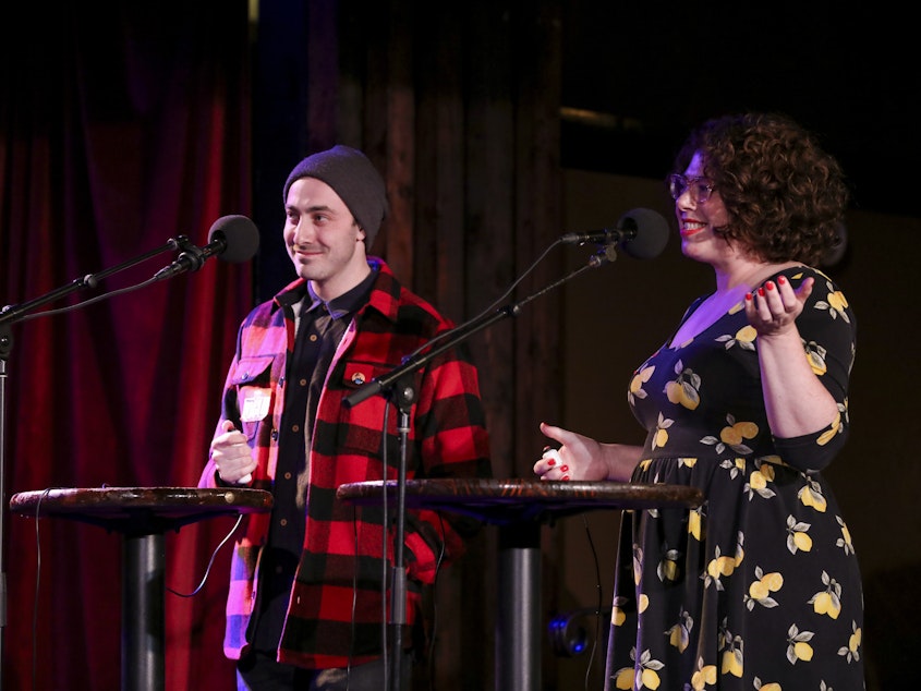 caption: Contestants Joel Kotler and Allison Kave appear on Ask Me Another at the Bell House in Brooklyn, New York.