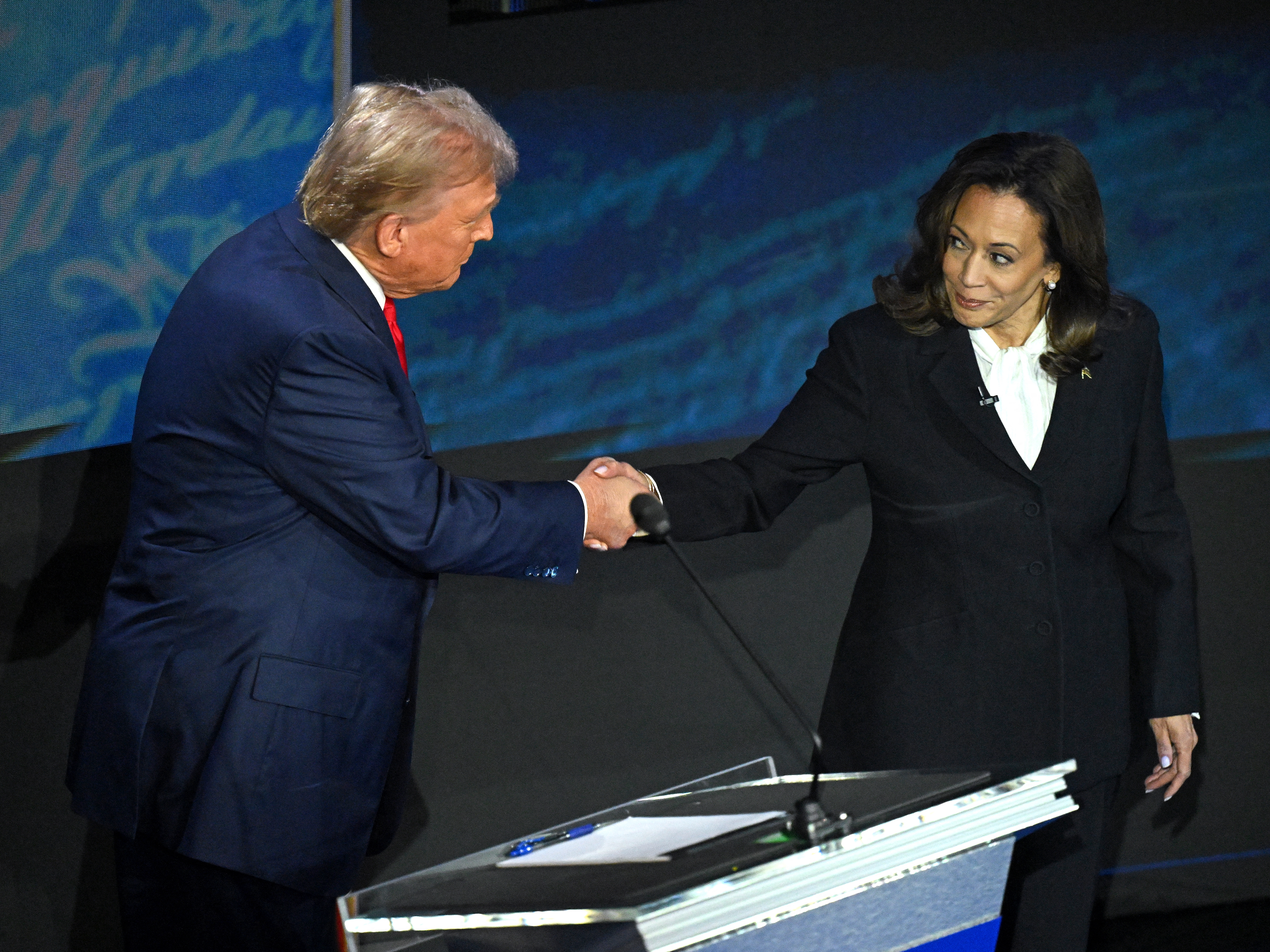 caption: Vice President Kamala Harris and former President Trump shake hands during their debate on Sept. 10. Whoever wins the election could shape the Supreme Court for years.