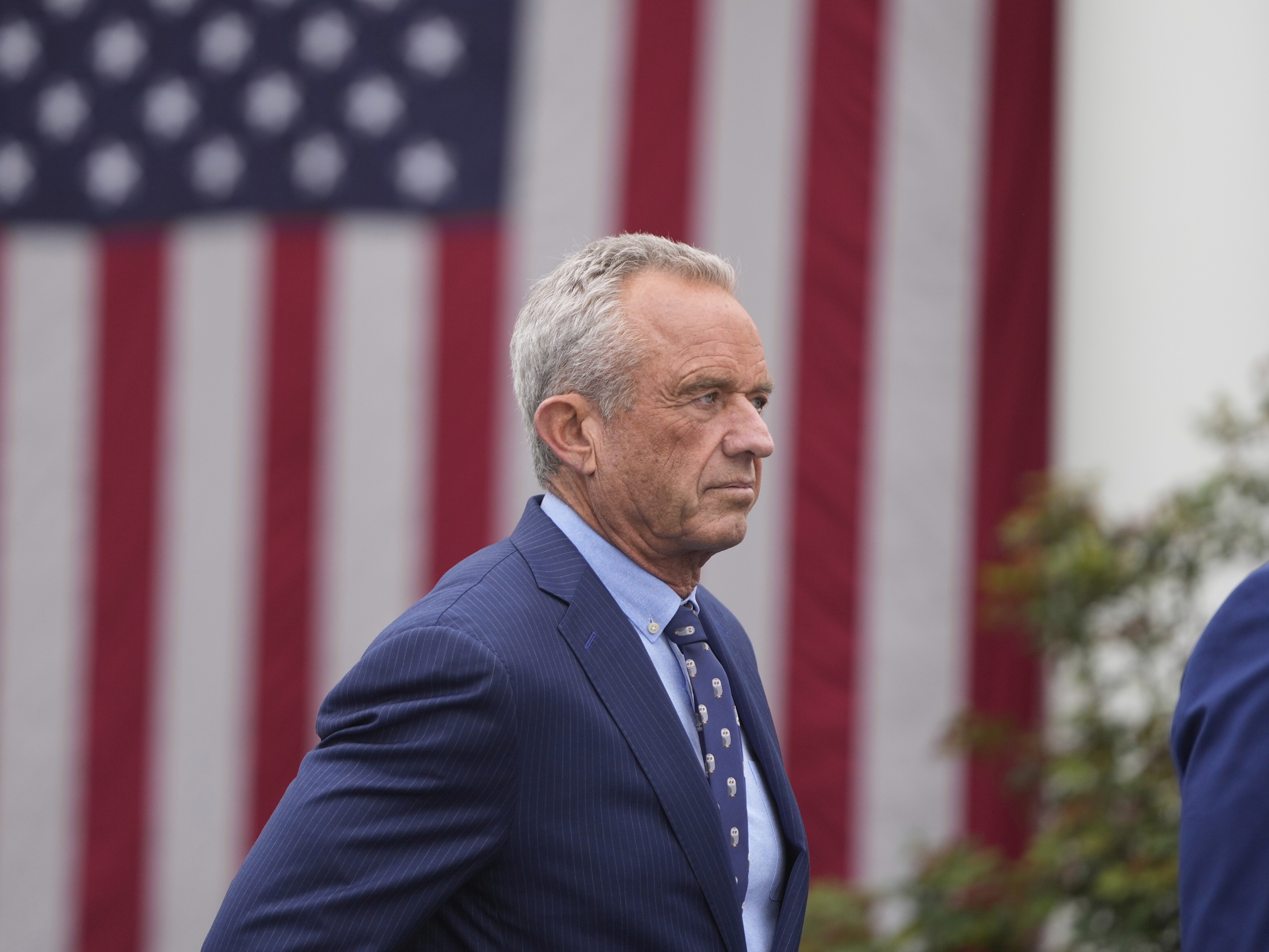 caption: Health and Human Services Secretary Robert F. Kennedy Jr. arrives before President Trump speaks during an event to announce new tariffs Wednesday in the Rose Garden at the White House in Washington, D.C.