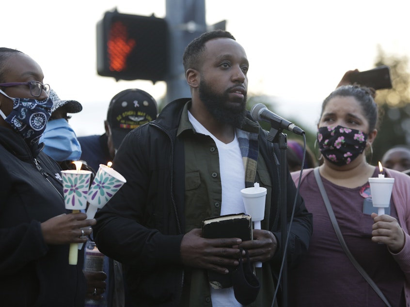 caption: Matthew Ellis speaks at a vigil at the intersection where his brother, Manuel Ellis, a 33-year-old black man, died in police custody in Tacoma, Wash. Ellis's death was ruled a homicide this week by the Pierce County Medical Examiners Office.