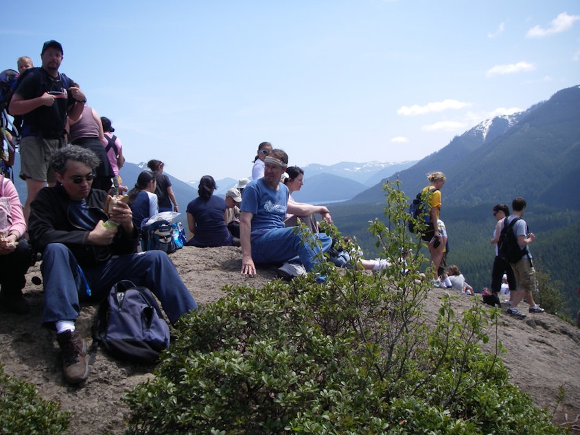 caption: Hikers at Rattlesnake Ledge. The number of visitors to this trail have been increasing over the last years.