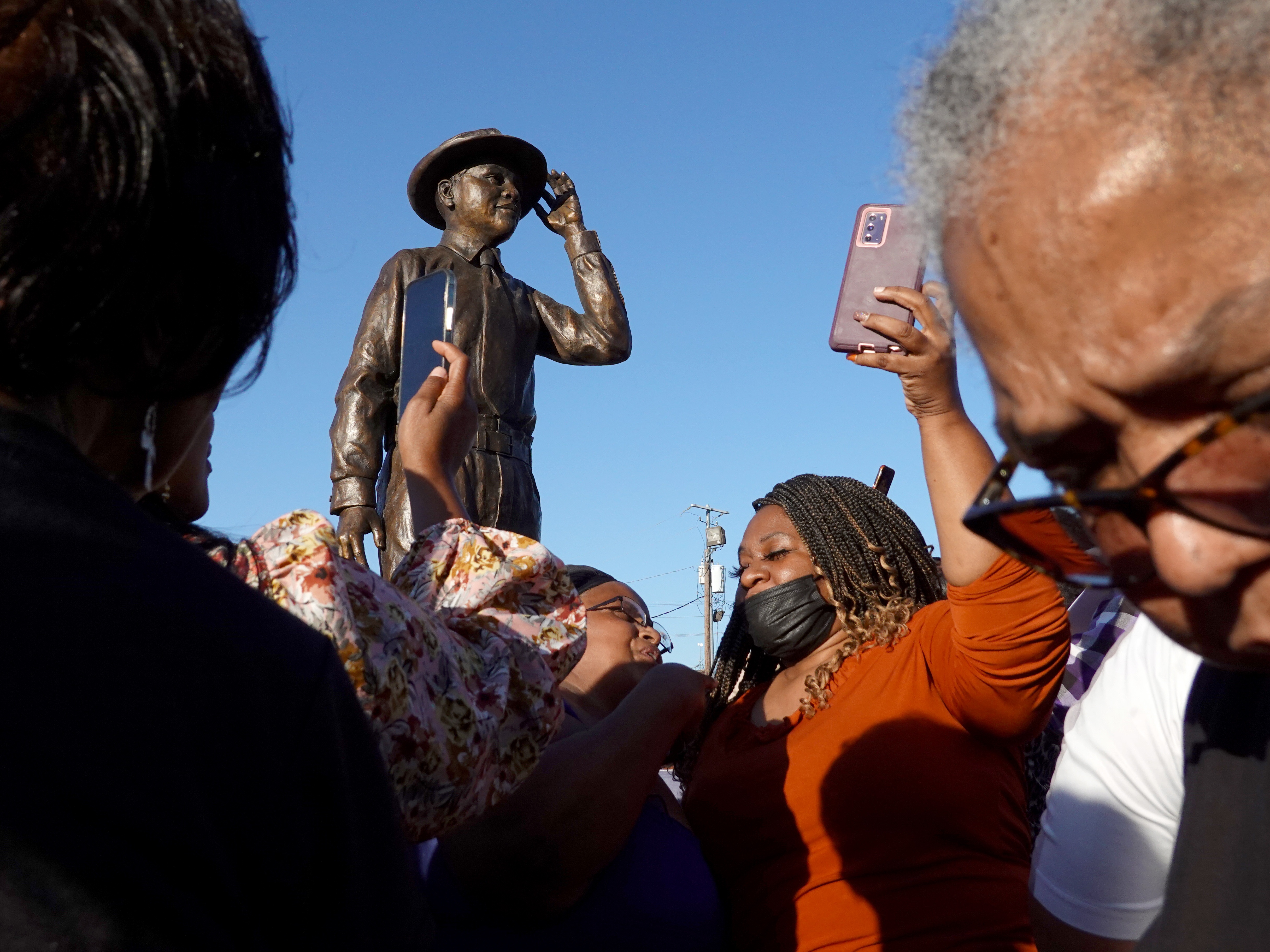 caption: A statue of Emmett Till is unveiled on October 21, 2022, in Greenwood, Miss., in memory of 14-year-old Emmett Till. His 1955 lynching is considered the spark that ignited the civil rights movement.