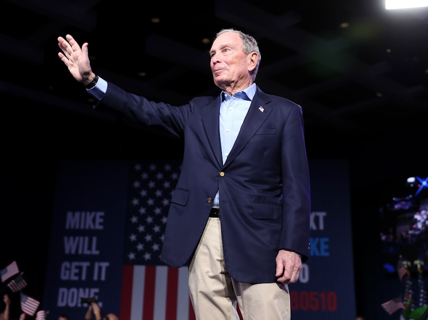 caption: Mike Bloomberg waves to his supporters at his Super Tuesday night event on March 3. Bloomberg dropped out of the Democratic primary race on Wednesday.