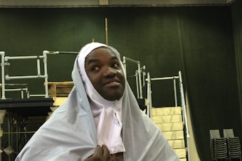 caption: Tenor Lawrence Brownlee clowns around during a Seattle Opera rehearsal for Rossini's 'The Wicked Adventures of Count Ory.'