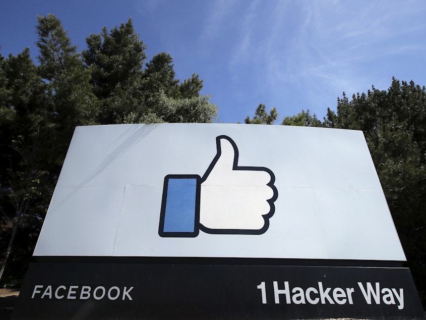 caption: Facebook said that if COVID-19 numbers in Menlo Park, Calif., the home of its headquarters, continue to decline, up to 10% of its workforce can go back to the office on May 10.