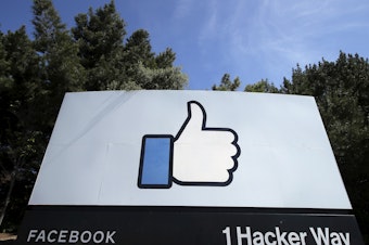 caption: Facebook said that if COVID-19 numbers in Menlo Park, Calif., the home of its headquarters, continue to decline, up to 10% of its workforce can go back to the office on May 10.