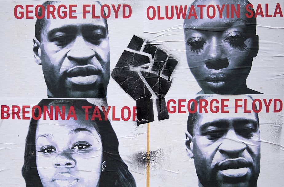 caption: Images of Black Americans unjustly killed at the hands of law enforcement, including George Floyd and Breonna Taylor are plastered to a wall inside the Capitol Hill Organized Protest zone, CHOP, on Monday, June 29, 2020, in Seattle. 