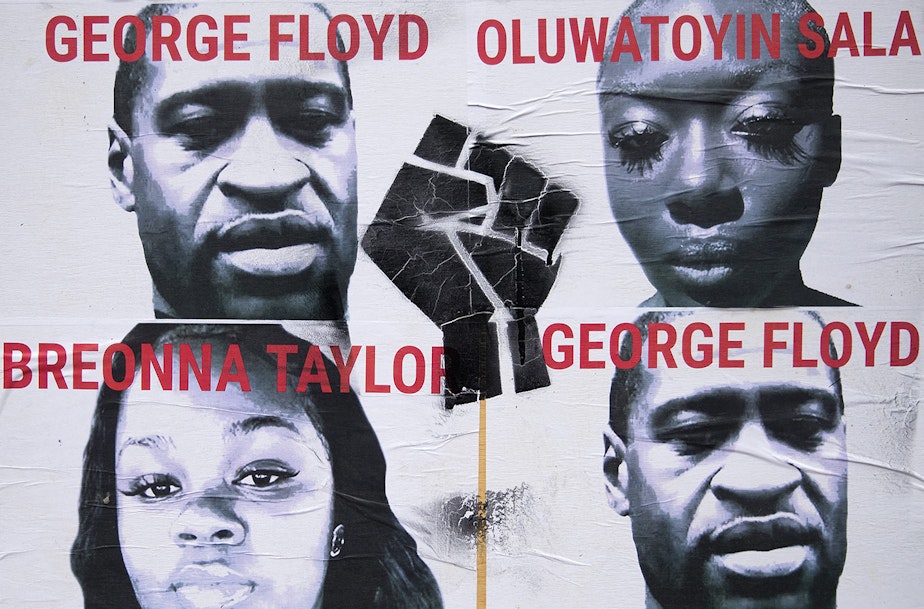 caption: Images of Black Americans unjustly killed at the hands of law enforcement, including George Floyd and Breonna Taylor are plastered to a wall inside the Capitol Hill Organized Protest zone, CHOP, on Monday, June 29, 2020, in Seattle.