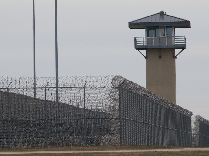 caption: A guard tower and prison yard at the Thomson Correctional Center in Thomson, Ill., in 2009. Five men have been killed at Thomson since 2019, making the facility one of the deadliest federal prisons in the country.