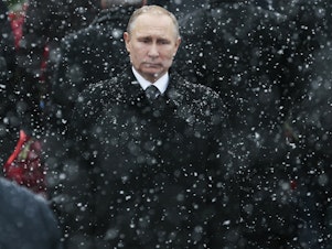 caption: Russian President Vladimir Putin, here at the Tomb of the Unknown Soldier in Moscow in 2017, has seen U.S. relations reach their lowest point since the Cold War. By waiting over a month to congratulate President-elect Joe Biden, Putin tried to show strength and that "he's ready to take the fight all the way to Washington," Russian political commentator Konstantin Eggert says.