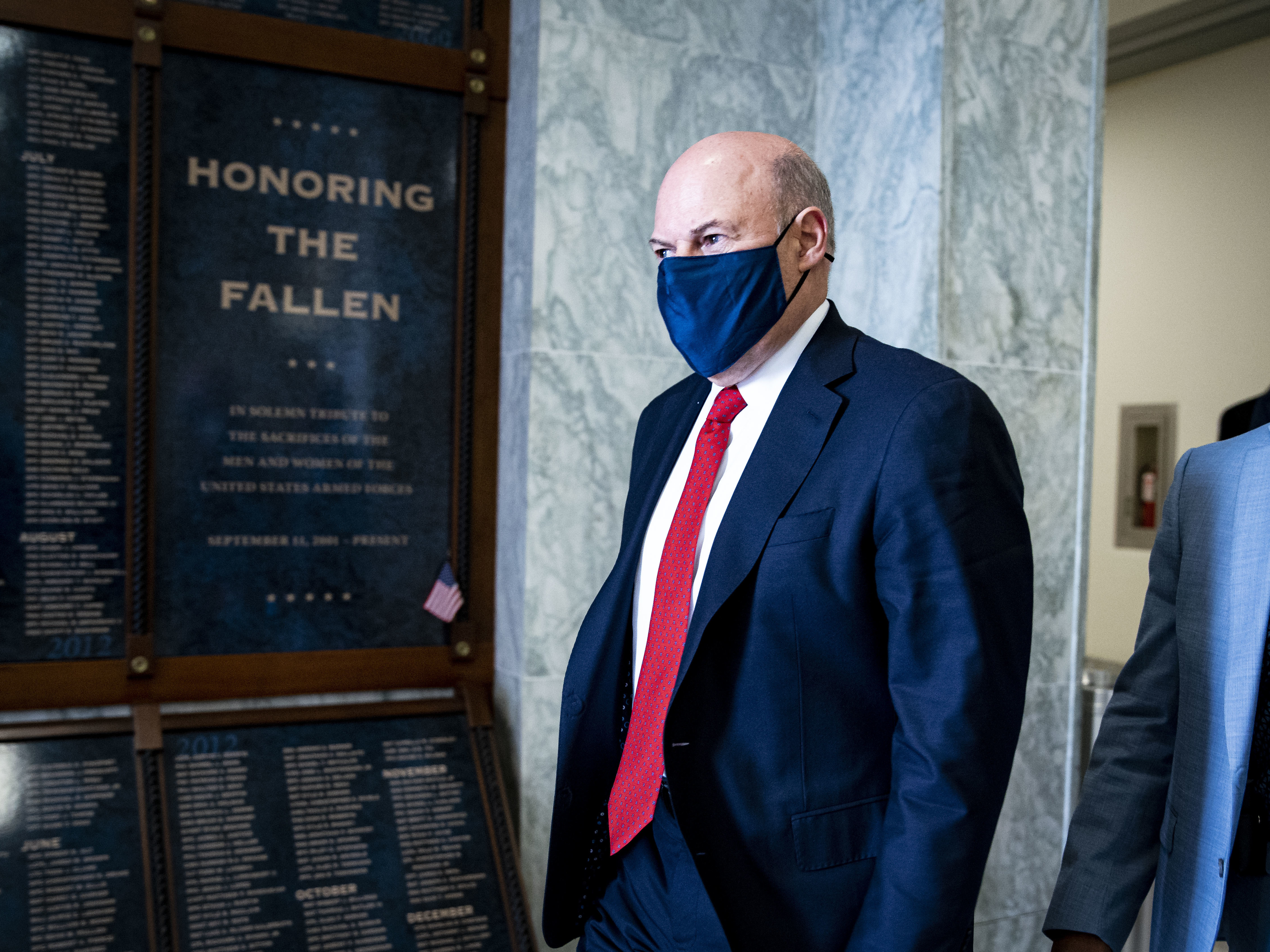 caption: Postmaster General Louis DeJoy, pictured last month on Capitol Hill, has announced a 10-year plan to reorganize the U.S. Postal Service. It has received a mixed reaction.