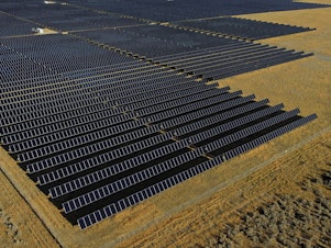caption: An International Energy Agency report says countries are setting records building solar power projects like this one in Mona, Utah in 2022.