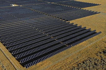 caption: An International Energy Agency report says countries are setting records building solar power projects like this one in Mona, Utah in 2022.