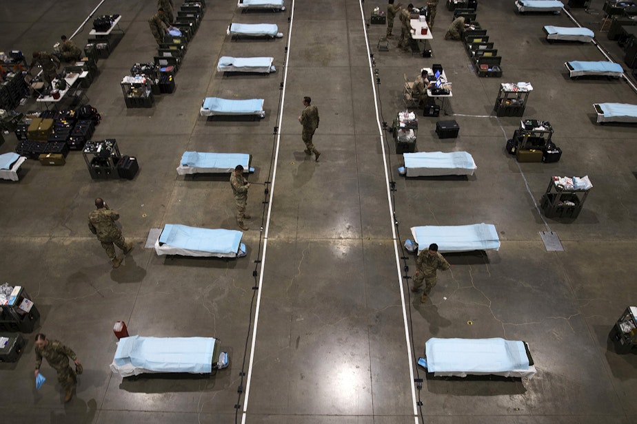 caption: U.S. Army soldiers from the 627th Army Hospital from Fort Carson, Colorado, as well as soldiers from JBLM set up a 250-bed military field hospital for non COVID-19 patients on Tuesday, March 31, 2020, at the CenturyLink Field Event Center in Seattle. On Wednesday, April 8, 2020, Gov. Jay Inslee announced that that the state would be returning the field hospital to the U.S. Department of Defense, without it ever receiving a patient.