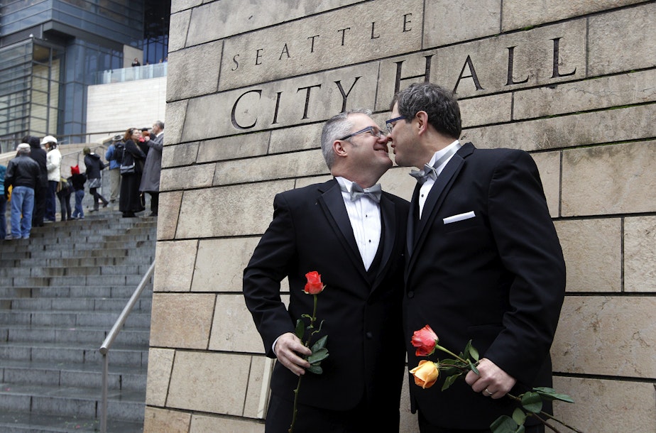 caption: Terry Gilbert, left, kisses his husband Paul Beppler after wedding at Seattle City Hall, becoming among the first gay couples to legally wed in the state, Sunday, Dec. 9, 2012, in Seattle. 
