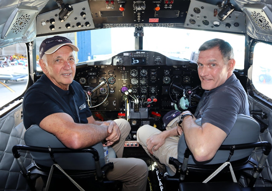 caption: Pilots Eugene Vezzetti, left, and Bill Mnich in the slightly-modernized cockpit of the historic DC-3.