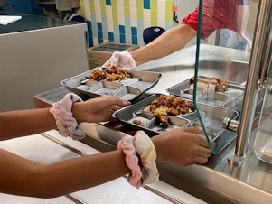 caption: For many public school districts now every meal, like this Mandarin Chicken at Compass Elementary in Kansas City is the culmination of a kind of treasure hunt to source food.