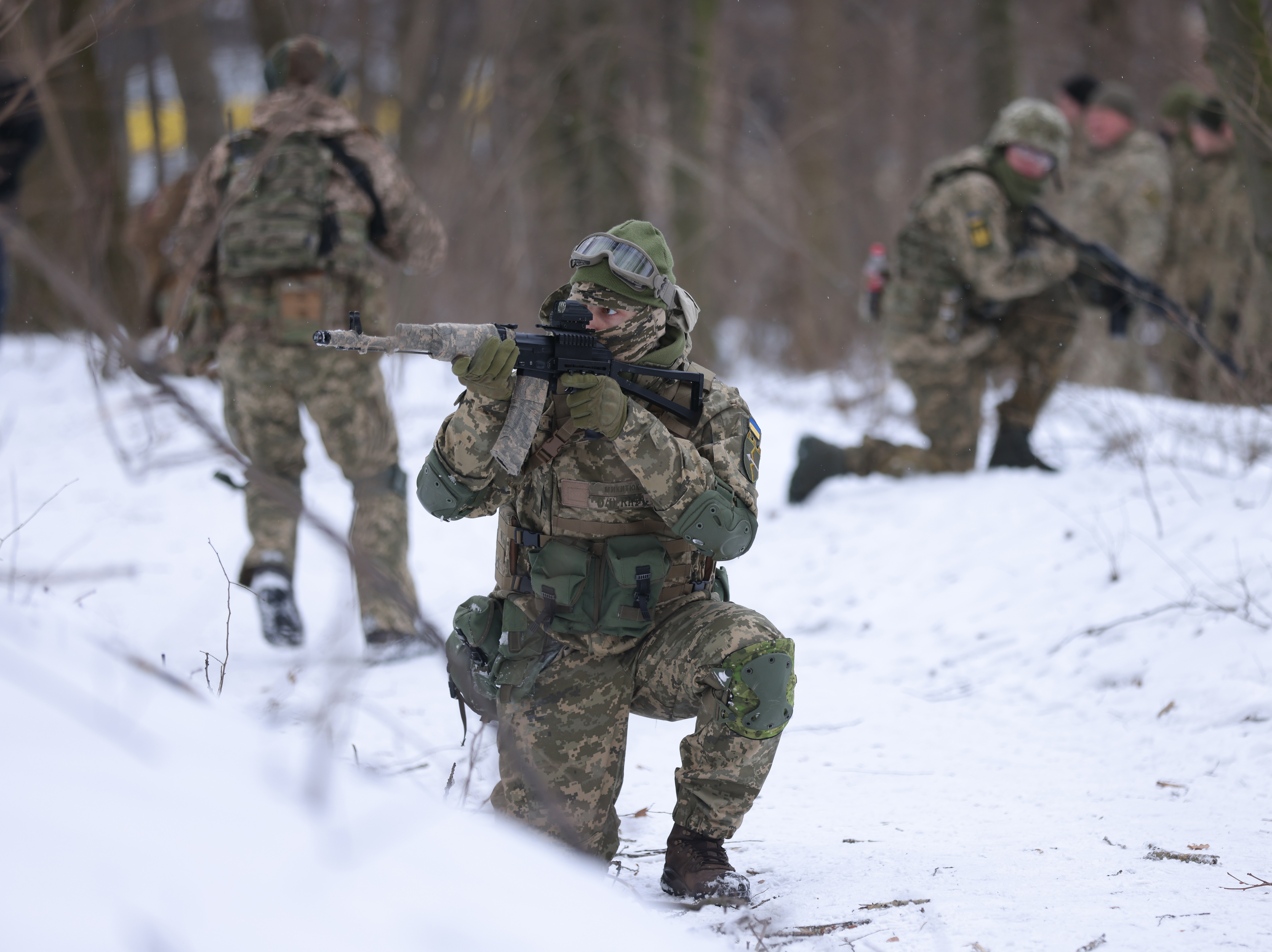 caption: Civilian participants in a Kyiv Territorial Defense unit train on a Saturday in a forest on Jan. 22, 2022 in Kyiv, Ukraine. Across Ukraine thousands of civilians are participating in such groups to receive basic combat training and in time of war would be under direct command of the Ukrainian military.