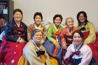 caption: Ruby Lee's grandma, mom, and great-aunts (from left: Andria Sueyoung Kim, Jackie Hyekoung Ro, Nancy Junghee Lee, Hae Ha Kwon, Eui Bun Lim, Haesook shin, and Sue Lim) during Korean New year in their hanboks, traditional Korean formal dresses.