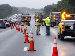 caption: Traffic on Interstate 95 was diverted for hours after a group of armed men fled from police near Wakefield, Mass. on Saturday. Massachusetts state police say 11 suspects have been taken into custody.