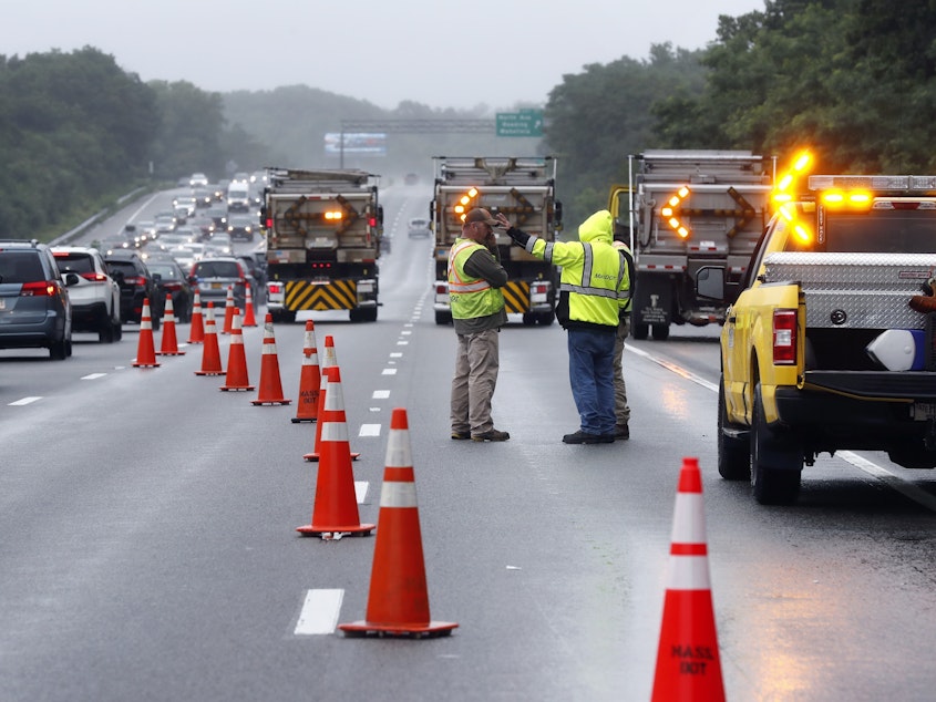 caption: Traffic on Interstate 95 was diverted for hours after a group of armed men fled from police near Wakefield, Mass. on Saturday. Massachusetts state police say 11 suspects have been taken into custody.