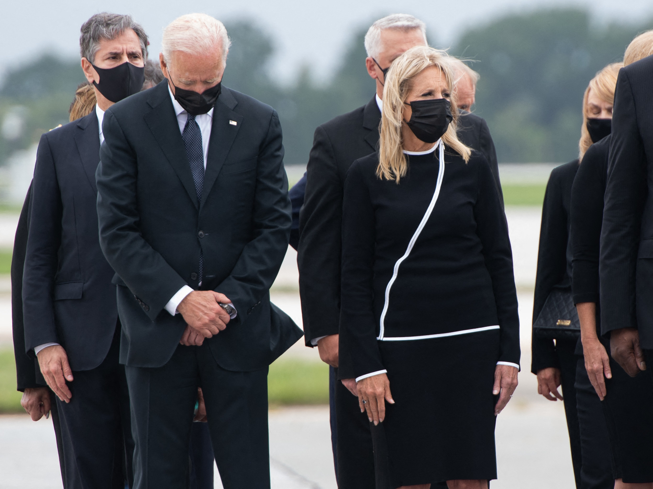 caption: In August, President Biden attended a dignified transfer ceremony at Dover Air Force Base after 13 members of the U.S. military were killed in an attack during the chaotic withdrawal from Afghanistan.