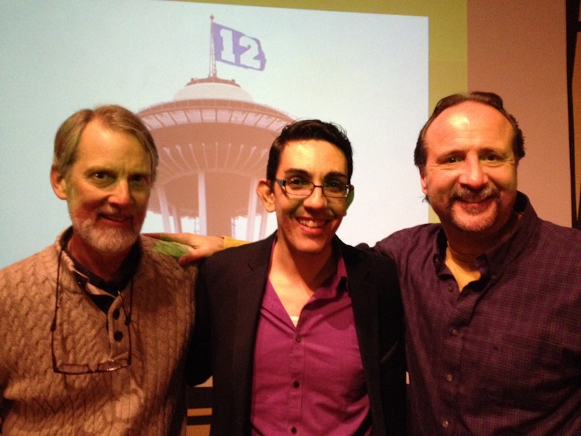 caption: Islamic scholar David Fenner, Zaki Abdelhamid of Humanities Washington and editorial cartoonist Milt Priggee at a Think & Drink discussion concerning the Charlie Hebdo attacks in January.