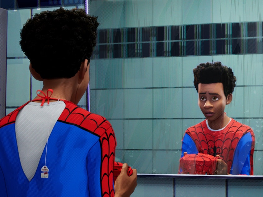 caption: The Afro-Latino Brooklynite Miles Morales is one of many characters who don the mask in the 2018 film <em>Spider-Man: Into The Spider-Verse</em>.