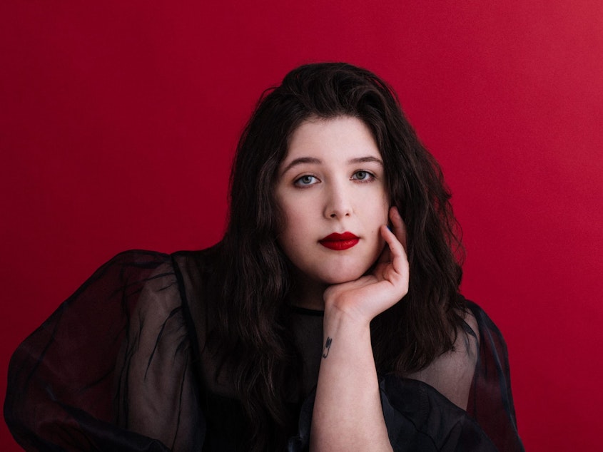 caption: "I feel like music is just a facet of my life, like it doesn't take hierarchical dominance over the people that I love and it never will," Lucy Dacus says. Her third album, <em>Home Video</em>, depicts memories and relationships from her years growing up in Richmond, Va.