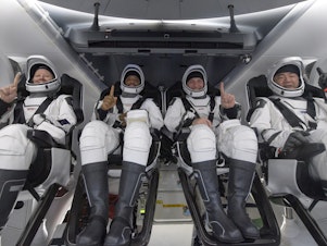 caption: NASA astronauts Shannon Walker (left), Victor Glover, and Mike Hopkins, along with Japan Aerospace Exploration Agency astronaut Soichi Noguchi, are seen inside the SpaceX Crew Dragon Resilience spacecraft onboard the SpaceX GO Navigator recovery ship shortly after landing in the Gulf of Mexico off the coast of Panama City, Fla., on Sunday.