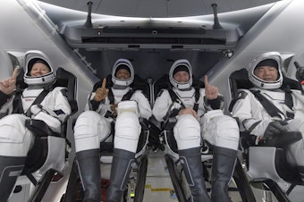 caption: NASA astronauts Shannon Walker (left), Victor Glover, and Mike Hopkins, along with Japan Aerospace Exploration Agency astronaut Soichi Noguchi, are seen inside the SpaceX Crew Dragon Resilience spacecraft onboard the SpaceX GO Navigator recovery ship shortly after landing in the Gulf of Mexico off the coast of Panama City, Fla., on Sunday.
