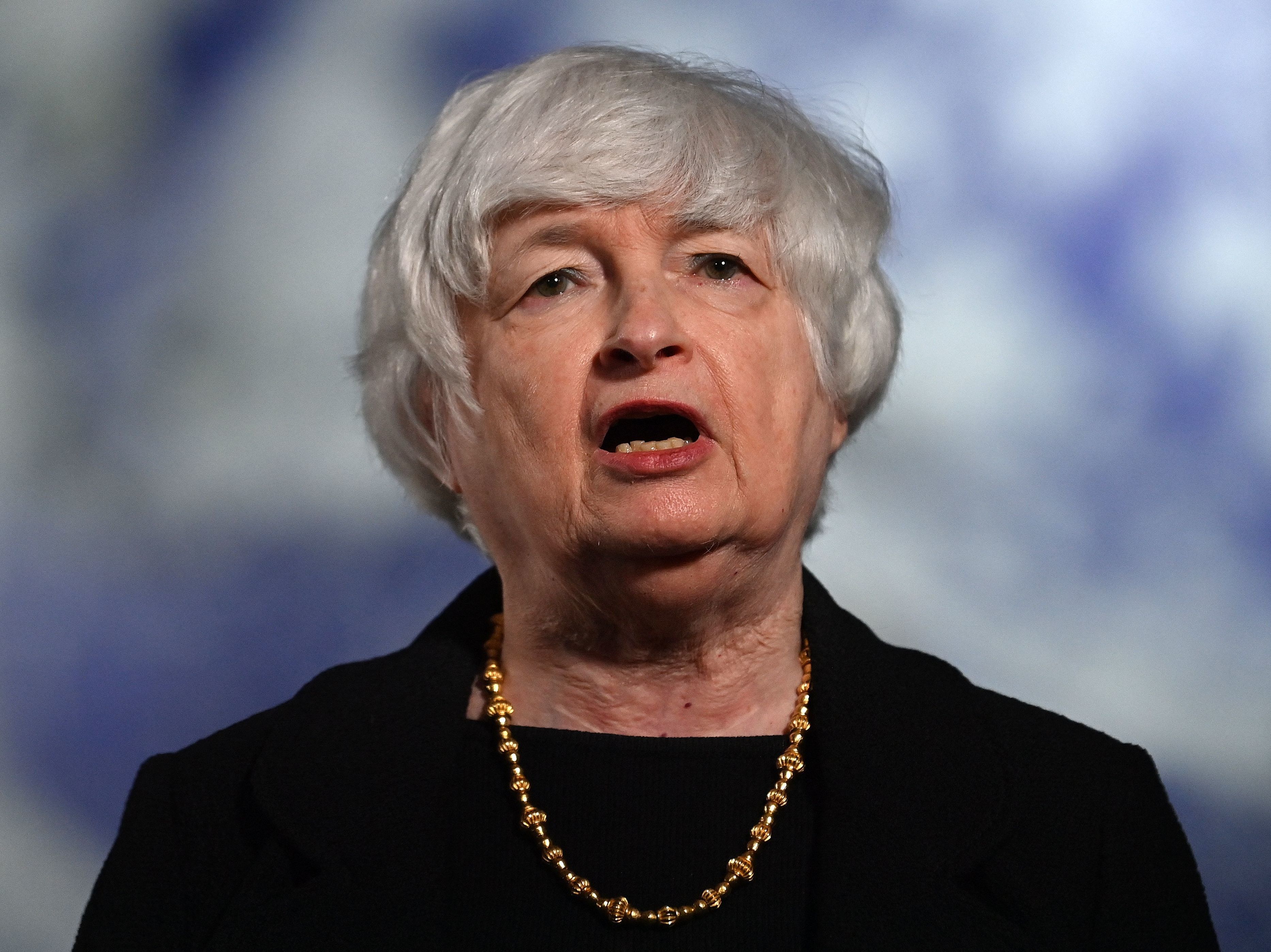 caption: Treasury Secretary Janet Yellen speaks to the press during the COP26 U.N. Climate Summit in Glasgow, Scotland, on Wednesday. In an interview with NPR's <em>Morning Edition</em>, Yellen said she expects inflation will moderate by next year. She also called on the private sector to do more to fight climate change.