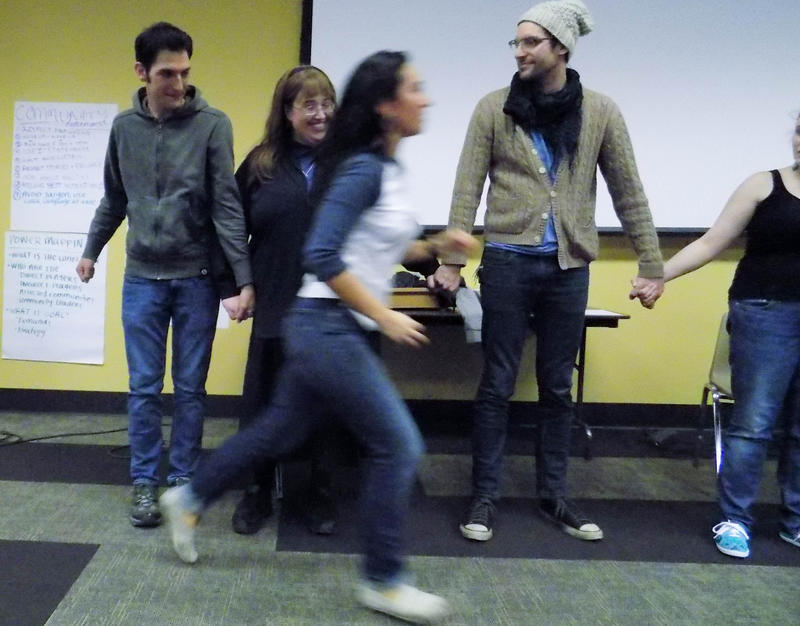caption: 'Direct action' trainer Ximena Velazquez-Arenas runs past some of the people she's training. Tap on this photo to see more images from the training.