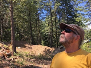 caption: <p>Chris Hopkins built a home in Pine Forest in the 1990s and lived there for more than a decade. He says it&rsquo;s the responsibility of individual property owners to protect their homes from wildfire.</p>