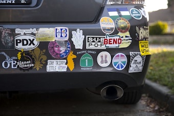 caption: Bumper stickers cover a Honda Accord on Wednesday, October 30, 2019, in Seattle.