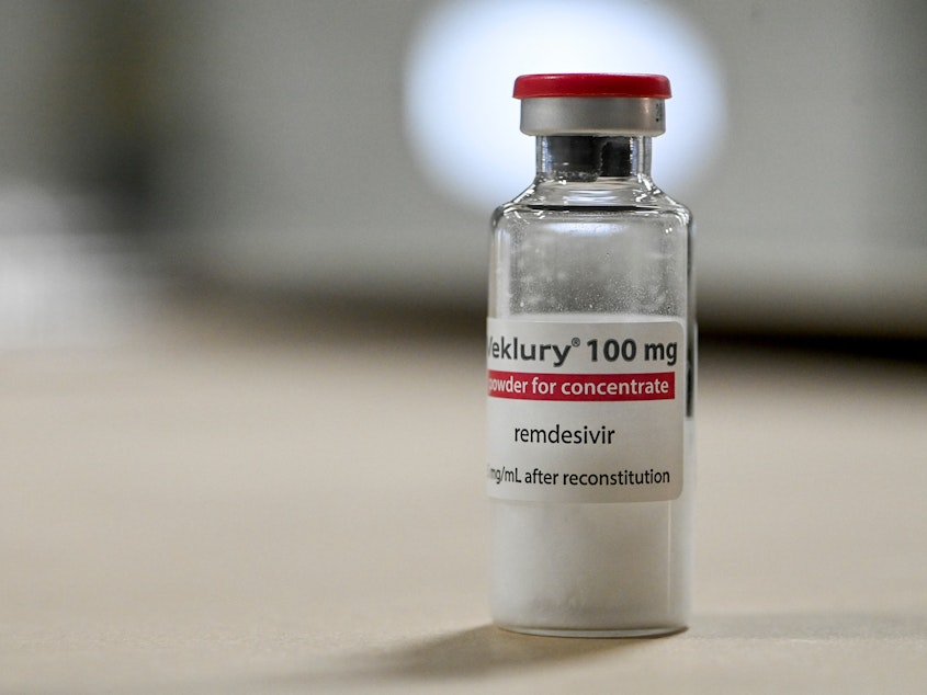 caption: A vial of remdesivir. The drug is sold in the U.S. under the brand Veklury.