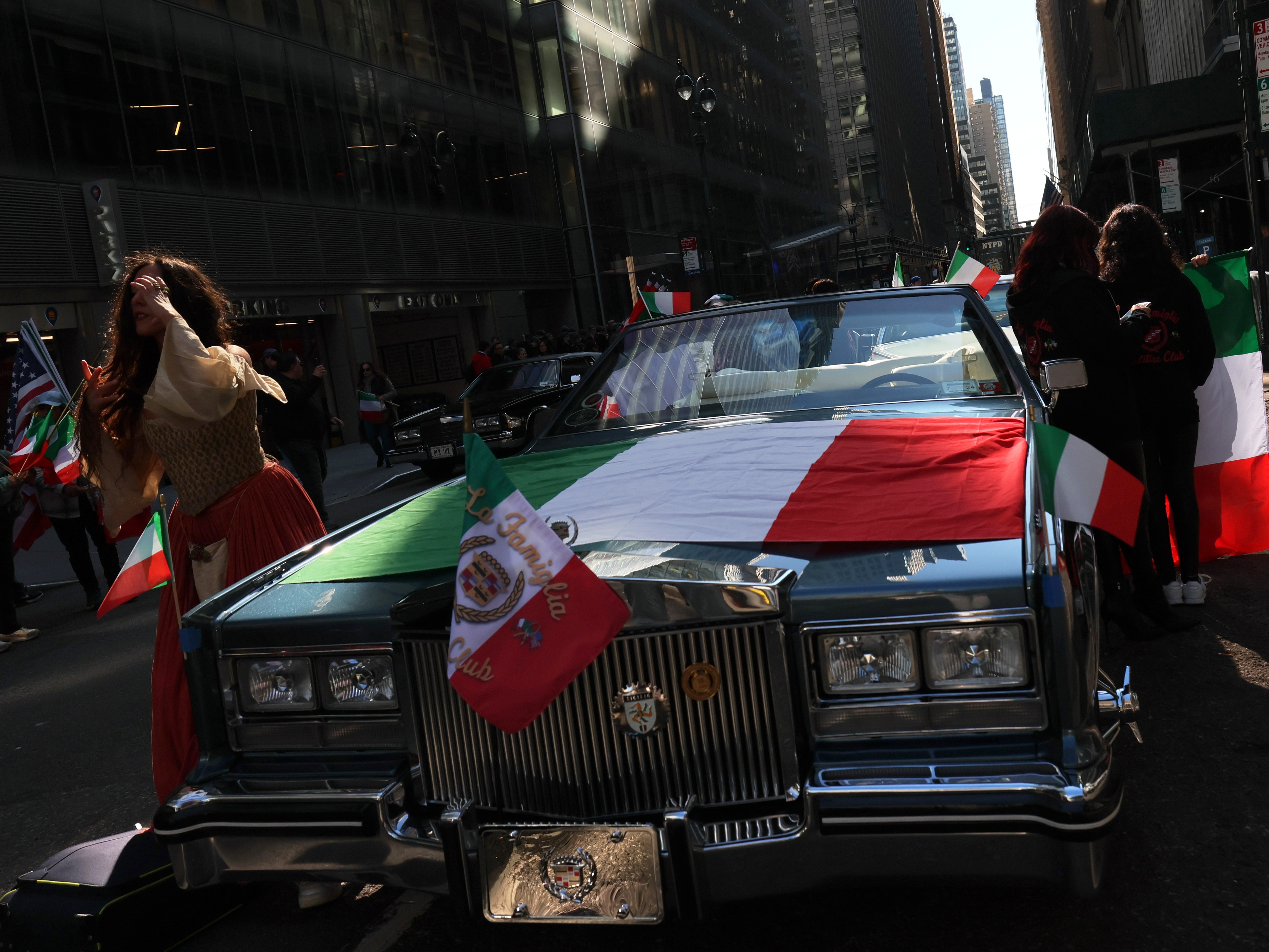 caption: A car with an Italian flag is seen at the annual Columbus Day Parade in New York City in 2023.