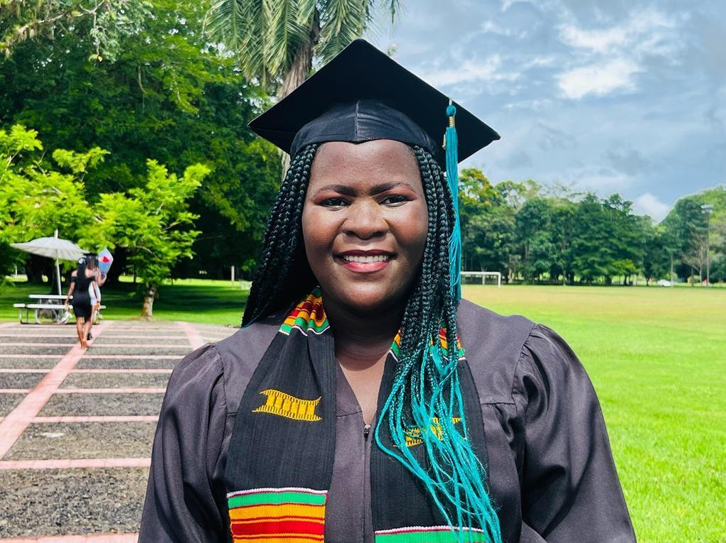 caption: Tawonga Zakeyu of Malawi graduated from Earth University in Costa Rica in December 2021 and now teaches women farmers how to cope with the challenges posed by a changing climate. Hint: Drip irrigation using recycled plastic bottles is a big help during a drought.