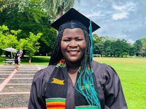 caption: Tawonga Zakeyu of Malawi graduated from Earth University in Costa Rica in December 2021 and now teaches women farmers how to cope with the challenges posed by a changing climate. Hint: Drip irrigation using recycled plastic bottles is a big help during a drought.