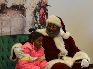 caption: Santa at the West Dallas Christmas Block Party
