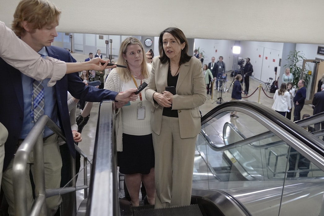 caption: Sen. Maria Cantwell, D-Wash., speaks with reporters at the Senate Subway on Capitol Hill Wednesday, March 20, 2024, in Washington.