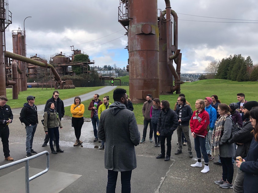 caption: Volunteers for the Bernie Sanders campaign met with field director Shaun Scott, center, before heading out from Gasworks Park on Sunday.